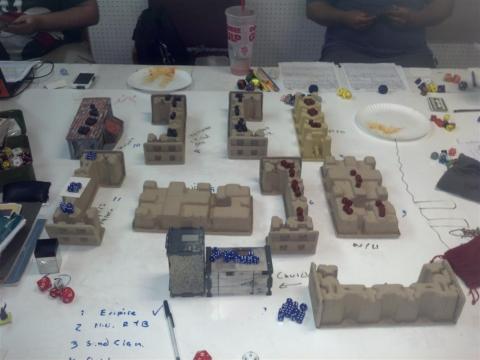 Map of playing area, dice are gargoyles.  Church lower center.  Gone from City Hall in center.  First batch from Inn on right.